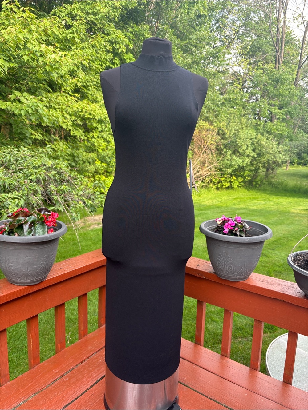 NWT Aqua is a (bloomingdale’s) product. this is a very fitted dress.